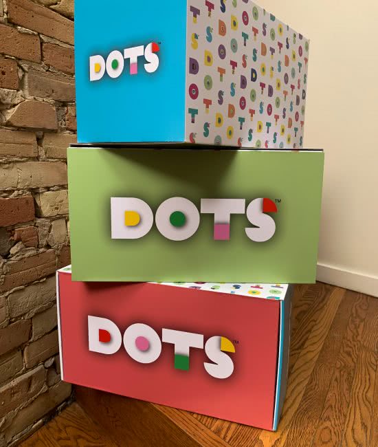 Custom print packaging in multi-colours with Dots logo